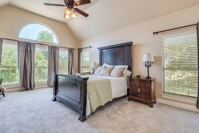 421 Huck Finn Trl, Dripping Springs, TX 78620 - bedroom with light colored carpet, vaulted ceiling, and ceiling fan