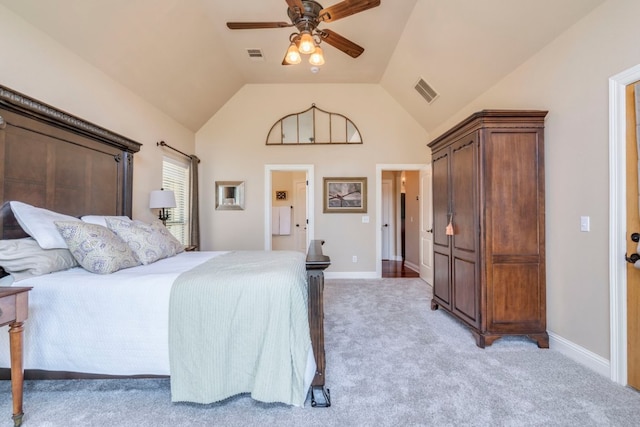 421 Huck Finn Trl, Dripping Springs, TX 78620 - bedroom with light carpet, vaulted ceiling, baseboards, a ceiling fan, and connected bathroom