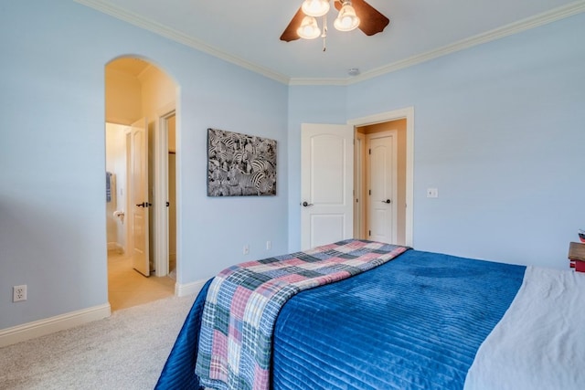 421 Huck Finn Trl, Dripping Springs, TX 78620 - carpeted bedroom with arched walkways, crown molding, baseboards, ceiling fan, and ensuite bath