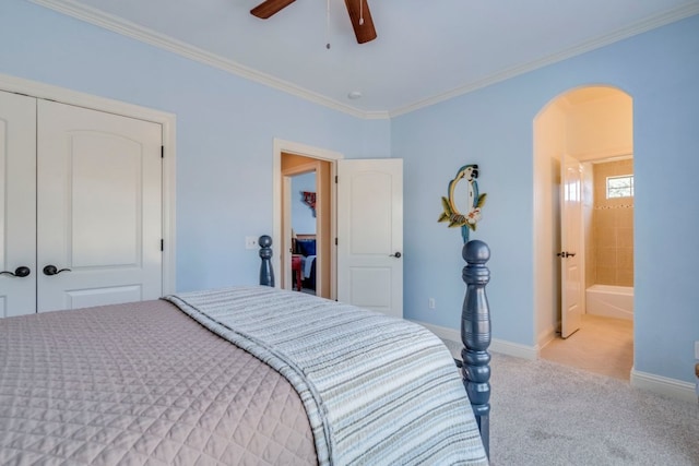 421 Huck Finn Trl, Dripping Springs, TX 78620 - bedroom featuring arched walkways, light carpet, baseboards, ornamental molding, and a ceiling fan