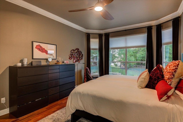 9508 Bully Hill Cv, Austin, TX 78759 - bedroom with ornamental molding, wood finished floors, and a ceiling fan