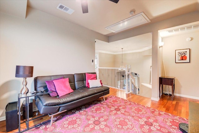 9508 Bully Hill Cv, Austin, TX 78759 - living room featuring attic access, wood finished floors, a ceiling fan, and baseboards