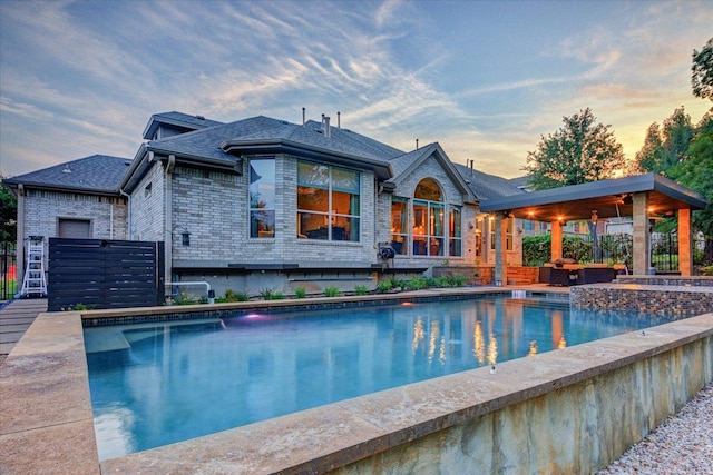 9508 Bully Hill Cv, Austin, TX 78759 - pool at dusk featuring an outdoor pool