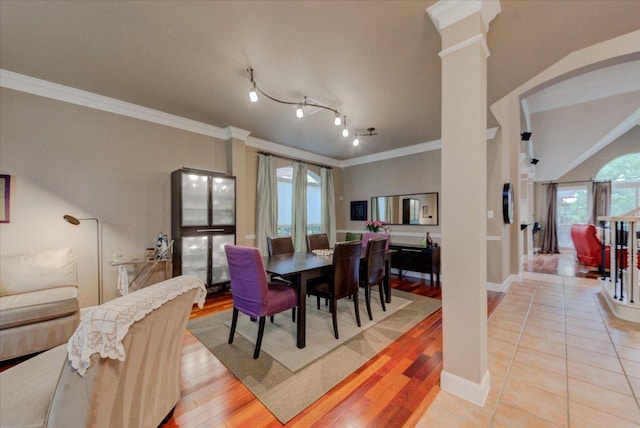 9508 Bully Hill Cv, Austin, TX 78759 - dining space with decorative columns, ornamental molding, baseboards, and light wood-type flooring