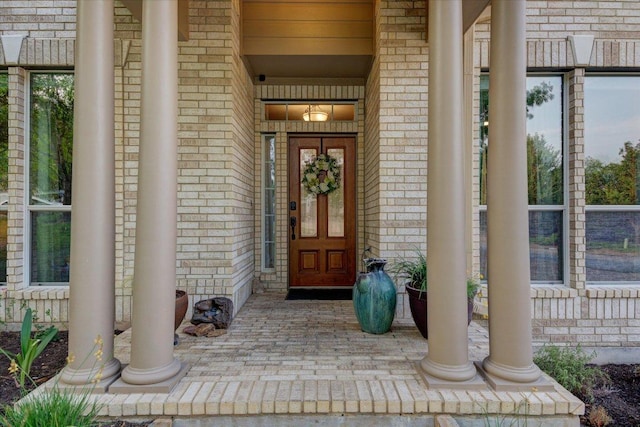 9508 Bully Hill Cv, Austin, TX 78759 - view of exterior entry with brick siding and a porch