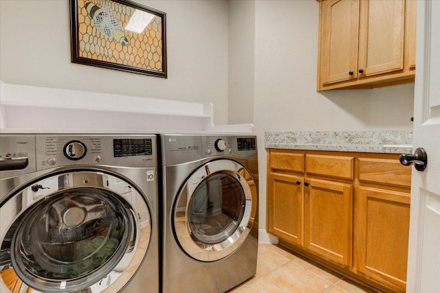 9508 Bully Hill Cv, Austin, TX 78759 - washroom with independent washer and dryer, cabinet space, and light tile patterned flooring
