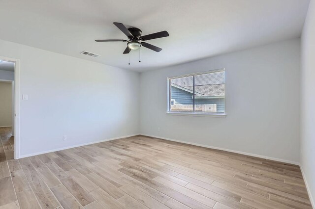 11306 Thorny Brook Trl, Austin, TX 78750 - spare room with light wood-style floors, ceiling fan, and baseboards