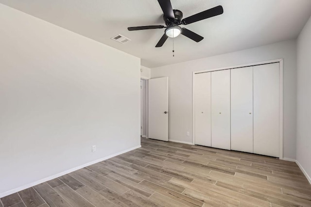11306 Thorny Brook Trl, Austin, TX 78750 - unfurnished bedroom with wood finished floors, baseboards, a closet, and ceiling fan