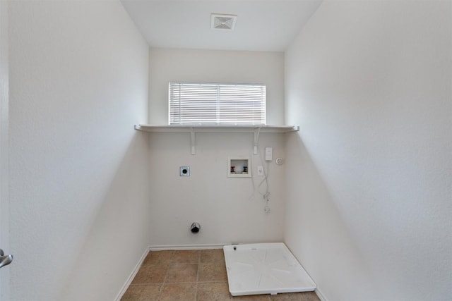 7432 Cayenne Ln, Austin, TX 78741 - laundry room featuring gas dryer hookup, electric dryer hookup, washer hookup, baseboards, and tile patterned flooring