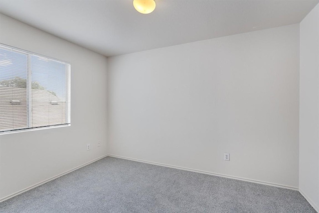 7432 Cayenne Ln, Austin, TX 78741 - empty room featuring carpet and baseboards