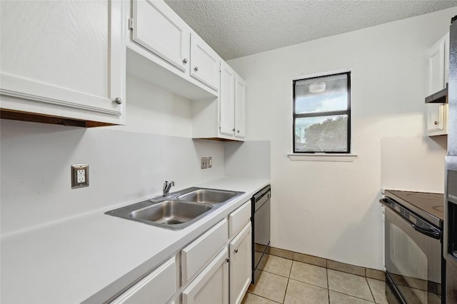 4307 S 1st St Unit 104, Austin, TX 78745 - kitchen with black appliances, light countertops, white cabinets, light tile patterned floors, and a textured ceiling