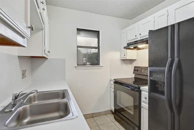 4307 S 1st St Unit 104, Austin, TX 78745 - kitchen with black appliances, under cabinet range hood, light countertops, and a textured ceiling
