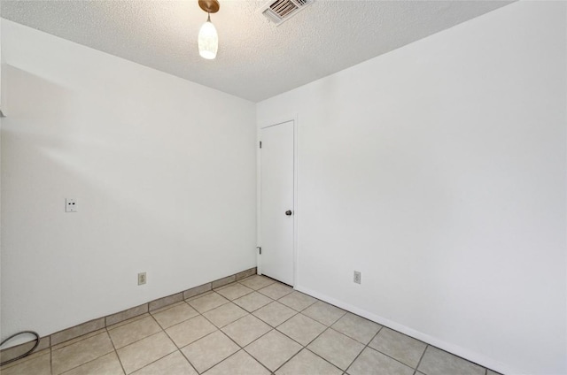 4307 S 1st St Unit 104, Austin, TX 78745 - spare room with a textured ceiling and baseboards