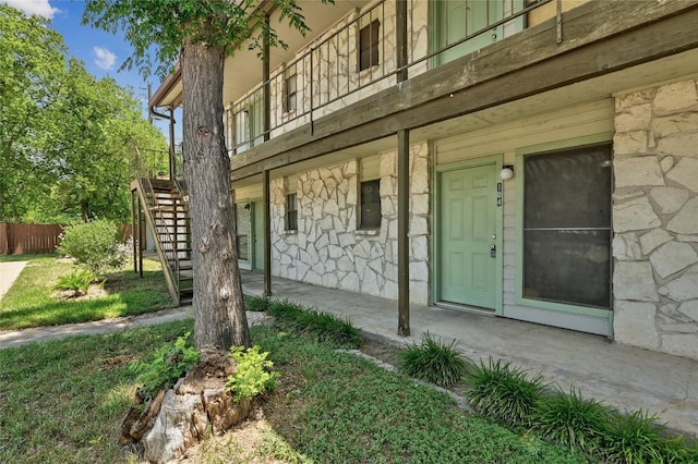 4307 S 1st St Unit 104, Austin, TX 78745 - view of exterior entry with stone siding