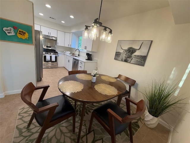 12225 Mosley Ln, Austin, TX 78727 - dining area with recessed lighting, light tile patterned floors, and baseboards