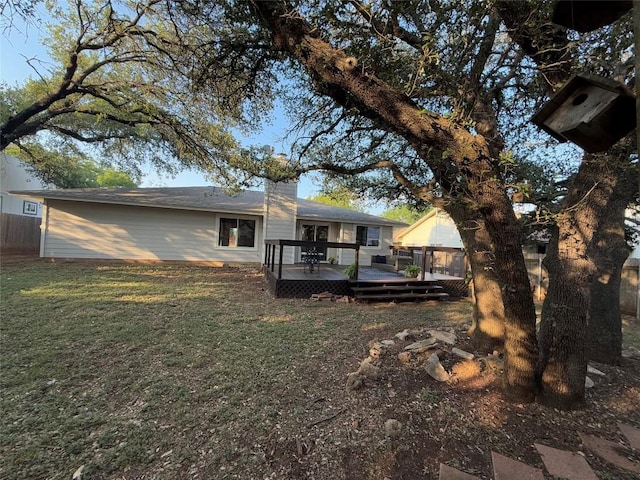 12225 Mosley Ln, Austin, TX 78727 - back of property with a wooden deck and a chimney