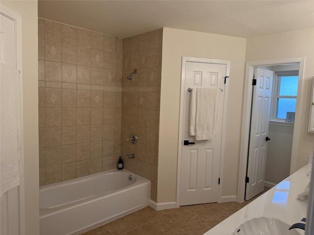 12225 Mosley Ln, Austin, TX 78727 - full bath with tile patterned flooring, shower / bath combination, double vanity, and baseboards