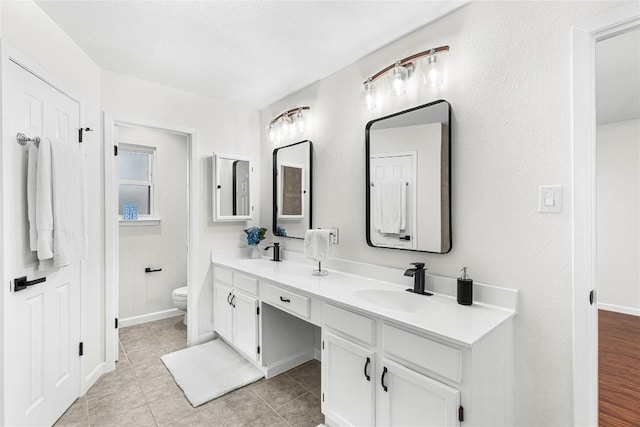 12225 Mosley Ln, Austin, TX 78727 - bathroom with double vanity and tile patterned floors