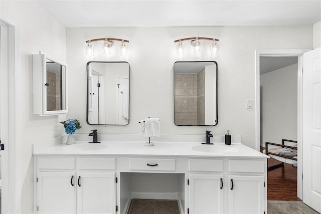 12225 Mosley Ln, Austin, TX 78727 - bathroom featuring double vanity and tile patterned floors