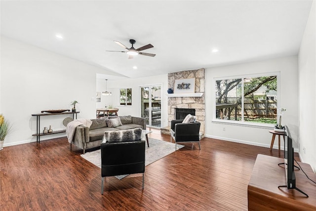 12225 Mosley Ln, Austin, TX 78727 - living area with a ceiling fan, wood finished floors, a fireplace, vaulted ceiling, and recessed lighting