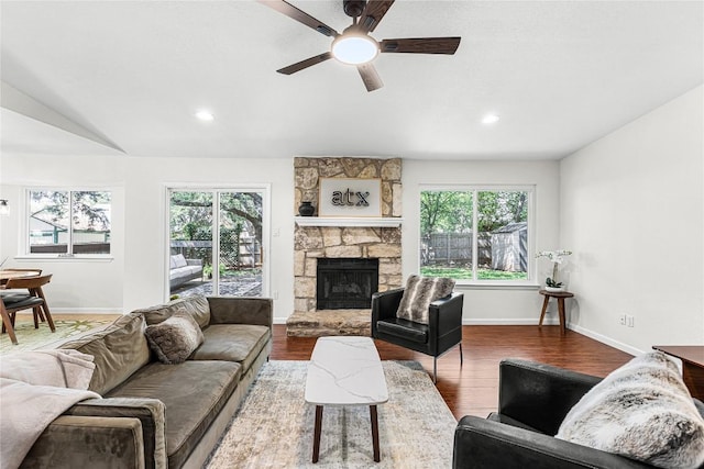 12225 Mosley Ln, Austin, TX 78727 - living room featuring healthy amount of natural light, ceiling fan, a fireplace, wood finished floors, and recessed lighting