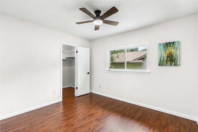 12225 Mosley Ln, Austin, TX 78727 - unfurnished bedroom featuring wood finished floors, a walk in closet, and ceiling fan