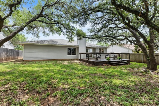 12225 Mosley Ln, Austin, TX 78727 - back of house featuring a fenced backyard and a wooden deck