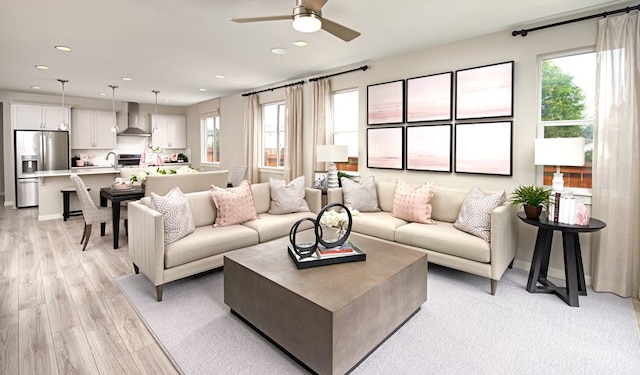 20503 Ed Townes Ter, Manor, TX 78653 - living room with ceiling fan, recessed lighting, and light wood-style flooring