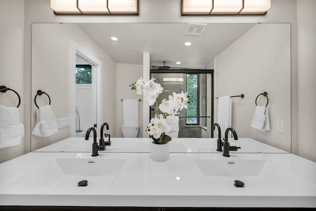 803 Josephine St, Austin, TX 78704 - full bath with plenty of natural light, recessed lighting, a stall shower, double vanity, and toilet