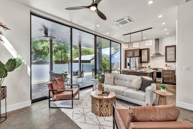 803 Josephine St, Austin, TX 78704 - living room featuring a ceiling fan, baseboards, a wall of windows, and recessed lighting