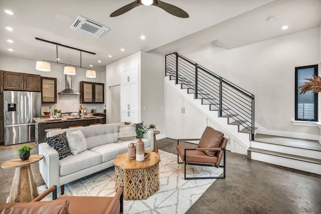 803 Josephine St, Austin, TX 78704 - living area with finished concrete flooring, stairs, ceiling fan, recessed lighting, and baseboards