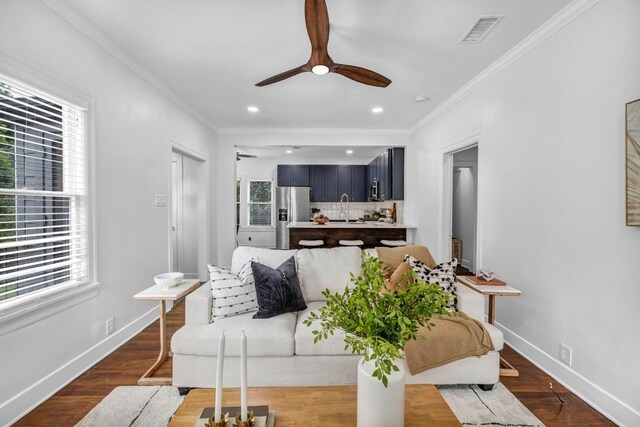 803 Josephine St, Austin, TX 78704 - living area with ceiling fan, healthy amount of natural light, crown molding, wood finished floors, and recessed lighting