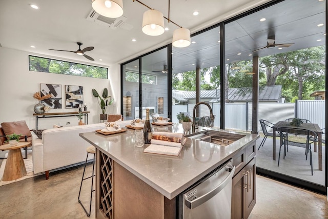 803 Josephine St, Austin, TX 78704 - kitchen with a ceiling fan, stainless steel dishwasher, finished concrete floors, floor to ceiling windows, and plenty of natural light