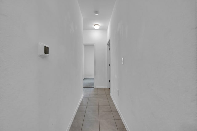 13013 Titanium St, Austin, TX 78754 - hallway with light tile patterned floors and baseboards