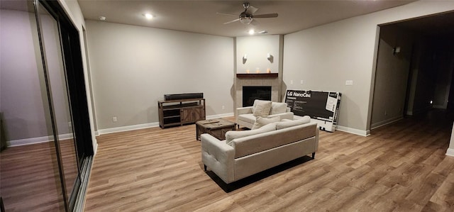 116 Merlin Ct, Cedar Creek, TX 78612 - living area with a ceiling fan, a fireplace, recessed lighting, and light wood-style flooring