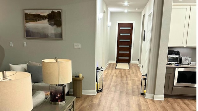116 Merlin Ct, Cedar Creek, TX 78612 - corridor with light wood-style flooring and baseboards