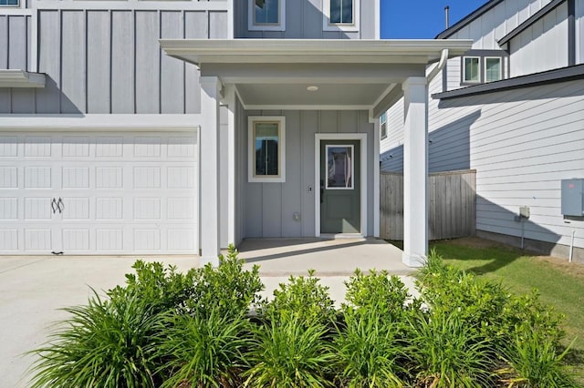 8513 Cottage Rose Dr, Austin, TX 78744 - entrance to property with board and batten siding, driveway, and a porch