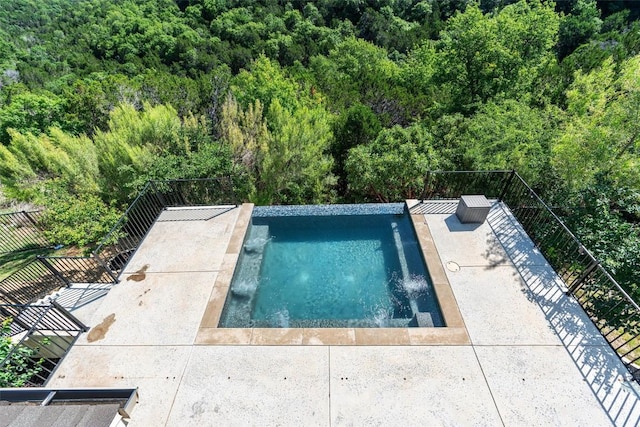 413 Mercer Falls Rd, Lakeway, TX 78738 - swimming pool with a view of trees and a patio area