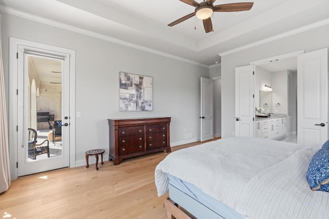 413 Mercer Falls Rd, Lakeway, TX 78738 - bedroom with light wood-style flooring, access to exterior, connected bathroom, crown molding, and a tray ceiling