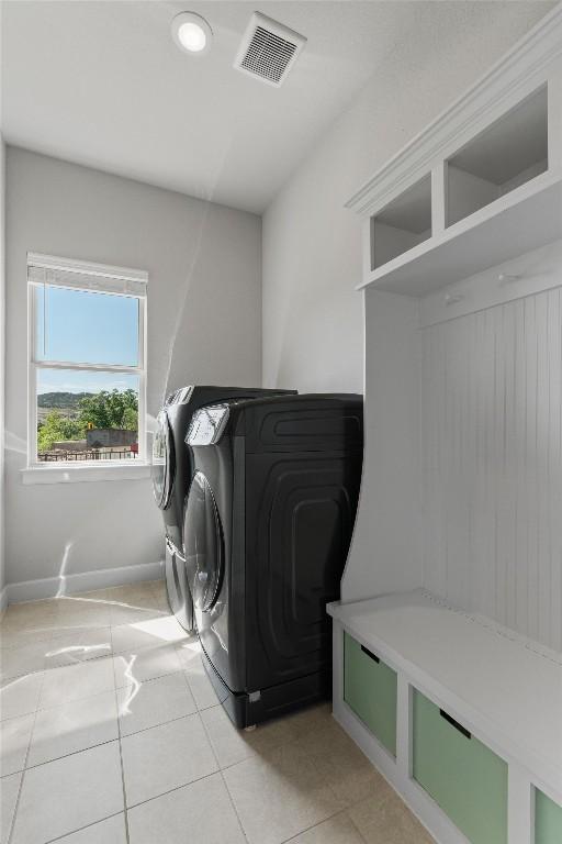 413 Mercer Falls Rd, Lakeway, TX 78738 - washroom with washing machine and clothes dryer, light tile patterned flooring, baseboards, and recessed lighting