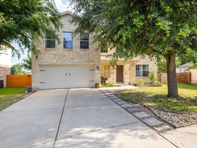 235 Herrera Trl, Hutto, TX 78634 - view of front of property with stone siding, driveway, an attached garage, and central AC