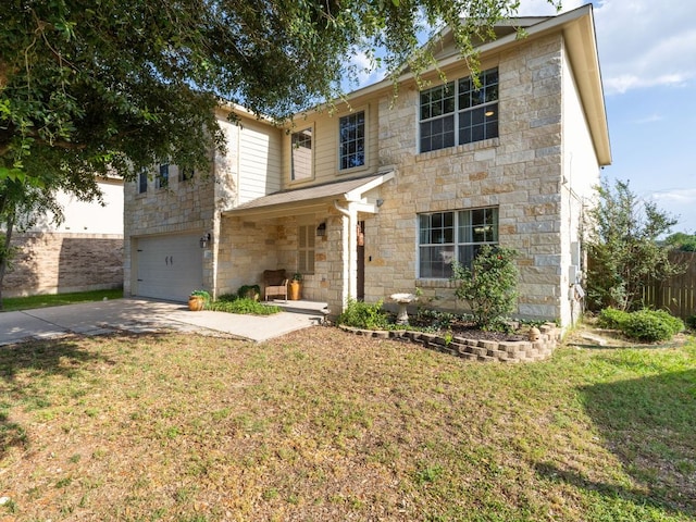 235 Herrera Trl, Hutto, TX 78634 - traditional-style home featuring stone siding, driveway, and an attached garage