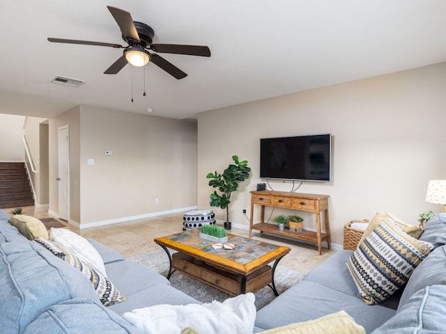 235 Herrera Trl, Hutto, TX 78634 - living area with stairs, ceiling fan, and baseboards