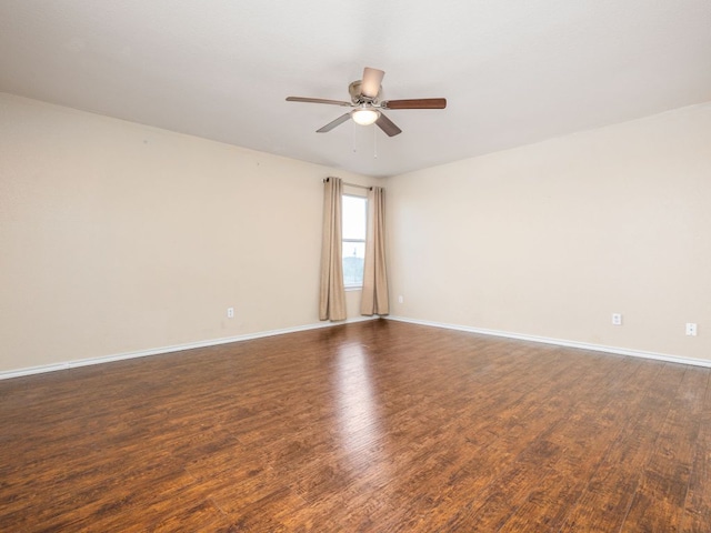 235 Herrera Trl, Hutto, TX 78634 - unfurnished room featuring ceiling fan, dark wood finished floors, and baseboards