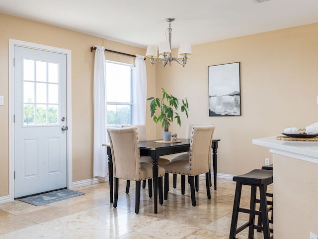 235 Herrera Trl, Hutto, TX 78634 - dining space featuring a chandelier, healthy amount of natural light, and baseboards
