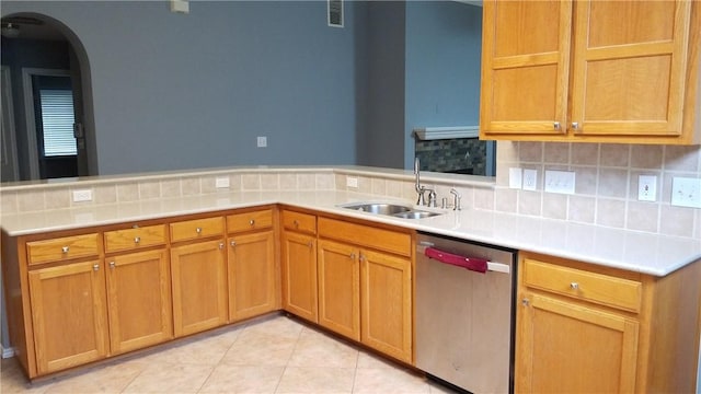 12828 Withers Way, Austin, TX 78727 - kitchen with dishwasher, a sink, arched walkways, light countertops, and backsplash