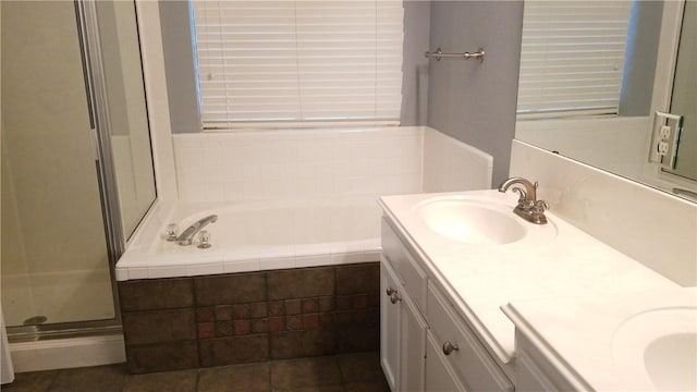 12828 Withers Way, Austin, TX 78727 - full bath featuring double vanity, a garden tub, and a shower stall