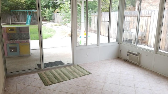 12828 Withers Way, Austin, TX 78727 - doorway with a wall mounted AC and light tile patterned floors