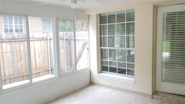 12828 Withers Way, Austin, TX 78727 - unfurnished sunroom featuring tile patterned floors and baseboards