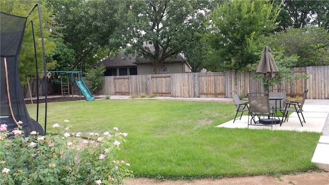 12828 Withers Way, Austin, TX 78727 - view of yard featuring a patio and a playground